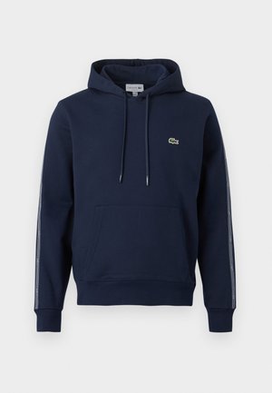 Navy blue hoodie with front kangaroo pocket, adjustable drawstring hood, and small green crocodile logo on the chest.