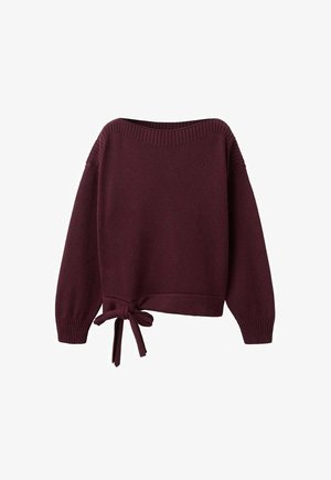 Burgundy long-sleeve knit sweater with boat neckline and a side tie knot at the hem.