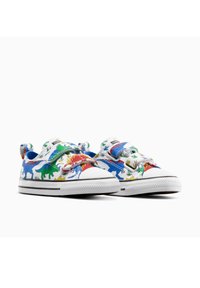 Sneakers in tela multicolore con motivi di dinosauri, punte in gomma bianca e strap in Velcro. Fodera interna imbottita e suole piatte.
