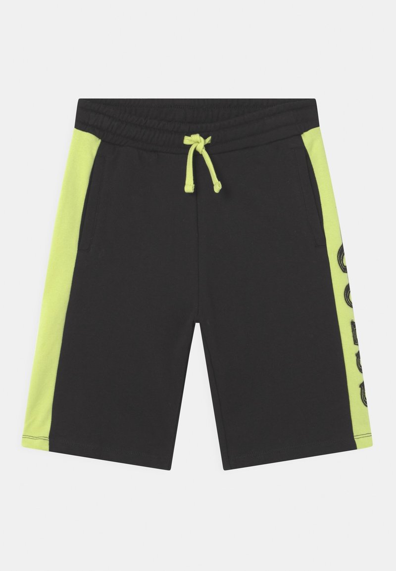 Short noir avec panneaux latéraux jaune fluo et cordon assorti, avec poches et texte graphique sur un côté.