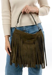 Green suede handbag with long fringes, top handle, and a magnetic closure. Features a stitched trim and a brand logo on the front.
