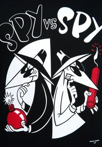 Black t-shirt featuring a graphic of two spies in contrasting colors, one holding a red bomb and the other a red stick of dynamite.