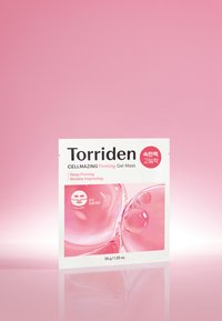 L'emballage du masque gel raffermissant CELLMAZING de Torriden présente une surface blanche brillante avec des bulles roses. Le texte inclut "Raffermissement Profond" et "Amélioration des Rides".