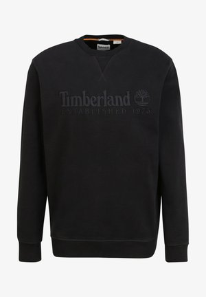 Sweat-shirt noir Timberland à col rond, manches longues et logo embossé indiquant Timberland Established 1973 sur le devant.