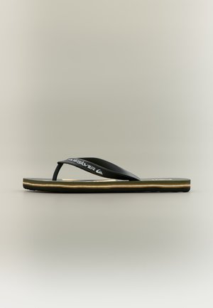 Sandale flip-flop noire avec bride Quiksilver de marque, dotée d'une semelle superposée en tons noir, beige et vert, présentée sur un fond neutre.