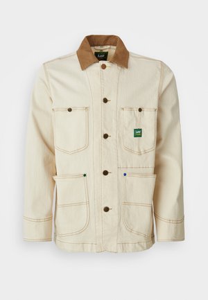 Bežna jakna iz bombaža z rjavim kordnim ovratnikom. Ima pet žepov, rjave gumbe in kontrastno šivanje za dodaten detajl.