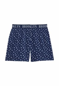 Bóxer navy de algodón, con un patrón floral en azul claro. Cintura elástica etiquetada como "BROOKLYN" y tres botones en la parte delantera.