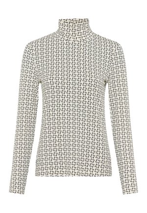 Lange mouwen coltrui in crème met een zwart geometrisch patroon. Beschikt over een strakke pasvorm en een zachte textuur.