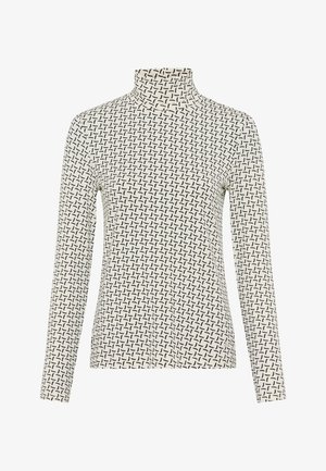 Lange mouwen coltrui in crème met een zwart geometrisch patroon. Beschikt over een strakke pasvorm en een zachte textuur.