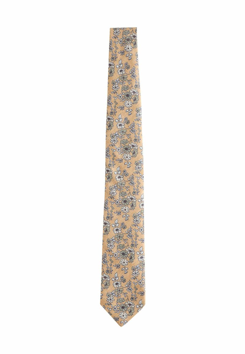 Floral tie in yellow fabric, featuring small blue and white flowers with green accents. Slim design with a pointed end.