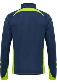 Marinblå sportjacka med limegröna detaljer. Har hög krage, långa ärmar och texturerade mönster på axelområdet.