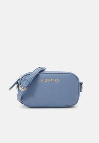 Blue leather crossbody bag with a gold logo and strap. Features a rectangular shape, smooth texture, and zipper closure.