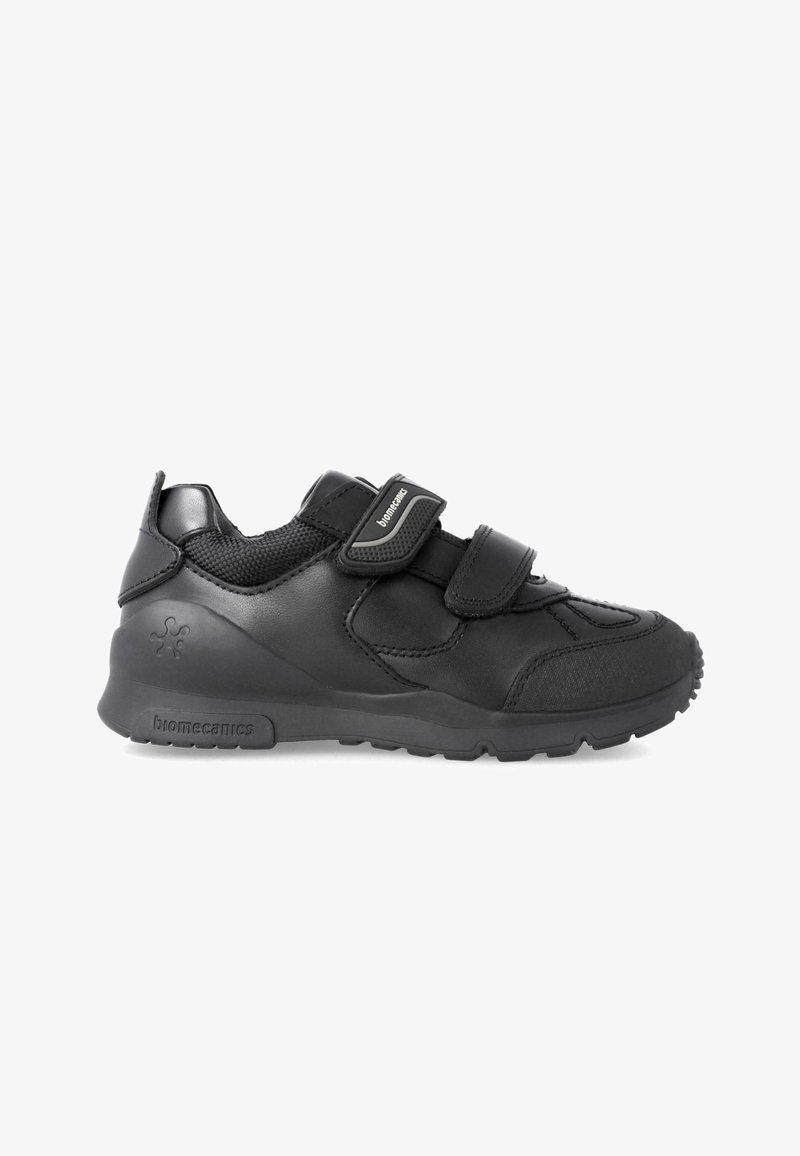 Black athletic shoes with Velcro straps, featuring smooth leather and mesh construction, a textured toe cap, and a chunky rubber sole.