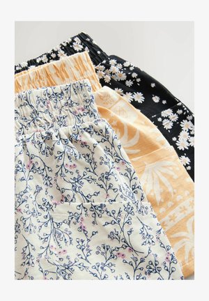 Set van vier stoffen shorts met elastische taillebanden. Bloemmotieven in blauw, wit, geel en zwart, met verschillende texturen en prints.