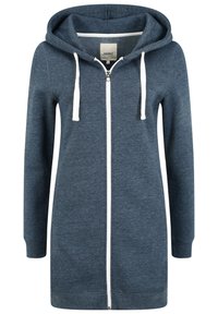 Mörkblå zip-up hoodie med en mjuk textur, vita dragsko, en framficka och en lång design som sträcker sig till mitten av låret.