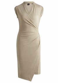 Beige, sleeveless wrap dress made of smooth fabric, featuring draped detailing, a V-neckline, and an asymmetric hemline.