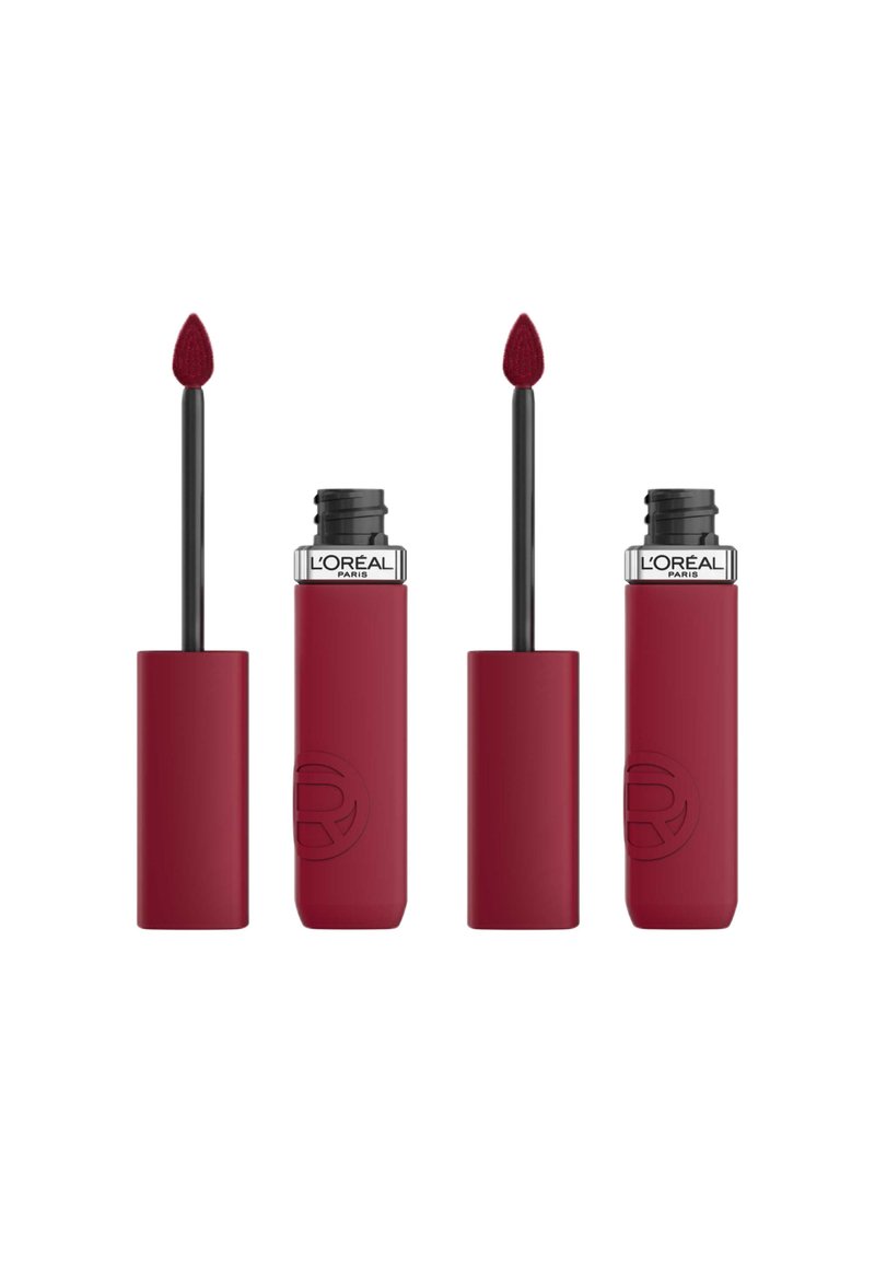 Rouge liquide à lèvres mat et profond avec un applicateur noir. Présente une pointe en mousse pointue et un capuchon slim et texturé pour une bonne prise en main. Marque L'Oréal Paris visible.