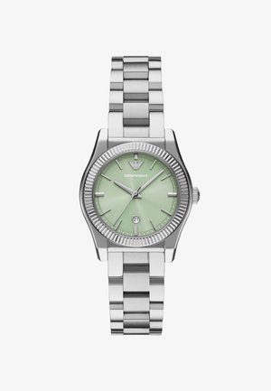 Silberner Edelstahluhren mit einem strukturierten mintgrünen Ziffernblatt. Verfügt über ein Datumsfenster auf 6 Uhr und eine geriffelte Lünette. Chunky Metallarmband.