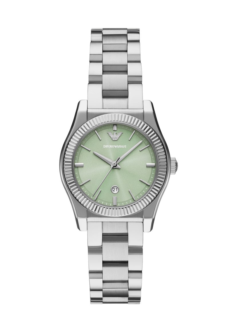 Silverfärgad rostfri klocka med en texturerad mintgrön urtavla. Har ett datumfönster kl. 6 och en ruggad bezell. Kraftigt metallarmband.