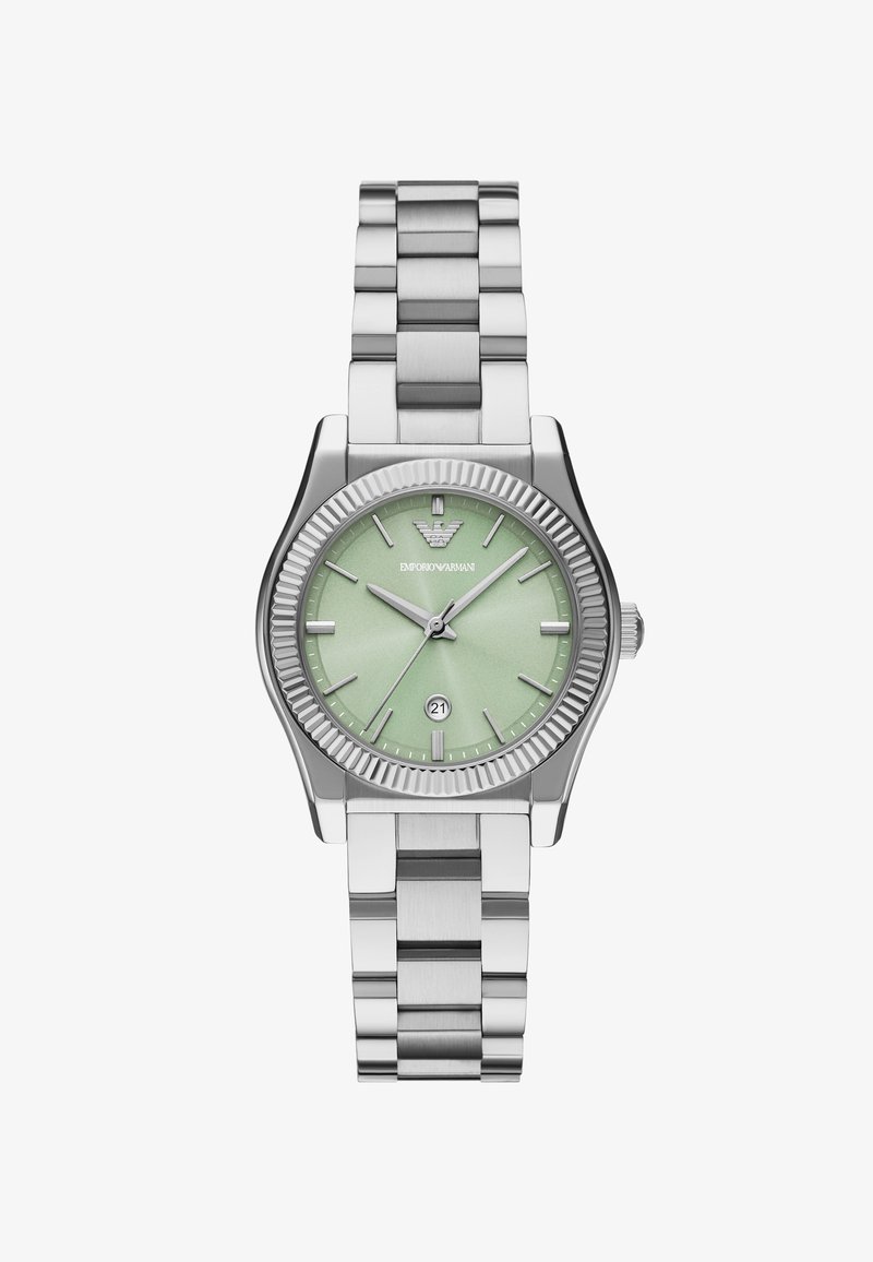 Silverfärgad rostfri klocka med en texturerad mintgrön urtavla. Har ett datumfönster kl. 6 och en ruggad bezell. Kraftigt metallarmband.