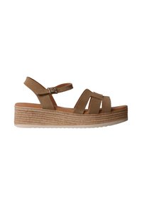 Sandale compensée en daim beige avec bride à boucle à la cheville et semelle plateforme tressée, design à bout ouvert.