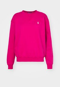 Cerise sweatshirt i bomullsblandning med långa ärmar, ribbade muddar och fåll samt en liten vit logga på vänster bröst.