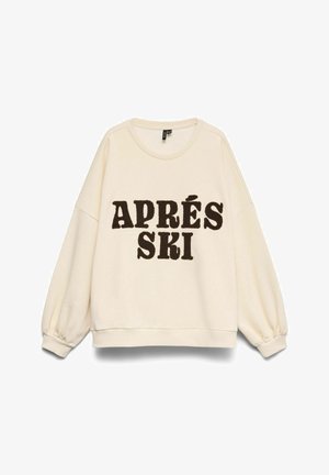 Kremfarvet sweatshirt med sænkede skuldre, elastiske manchetter og teksten "APRÉS SKI" i mørkebrune hævede bogstaver. Blød tekstur.