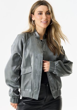 Gray bomber jacket with a shiny texture, ribbed cuffs, collar, and hem; features a front snap closure and side pockets.