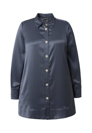 Camicia di satin blu navy con colletto, maniche lunghe e bottoni frontali con motivi floreali. Tessuto liscio e vestibilità leggermente oversize.