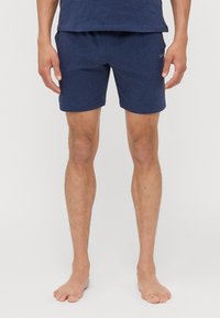 Navyblå bomullsshorts med slim fit, elastisk midja och diskret logotyp på nedre vänstra sidan.