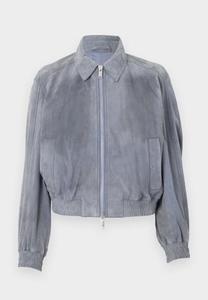 Blue suede crop jacket with a shirt collar, front zip closure, elasticated hem, and ribbed cuffs; minimalistic design with no visible patterns.