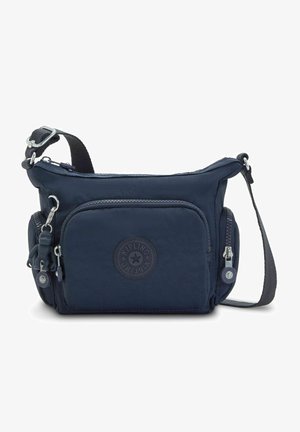 Navyblaue Nylon-Crossbody-Tasche mit verstellbarem Riemen, Reißverschlussfächern, Gummilogopatch und einer Affen-Schlüsselanhänger-Befestigung.