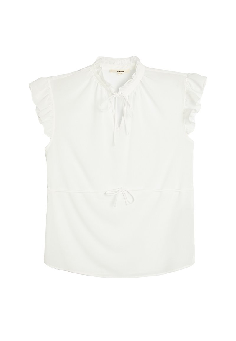 Top bianco con maniche corte a volant, scollatura arricciata e vita con coulisse. Realizzato in un tessuto morbido con una vestibilità leggermente ampia.