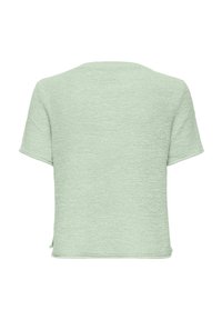 Haut à manches courtes en vert menthe clair, tissu en maille texturée, coupe carrée, encolure ronde et fentes latérales à l'ourlet.