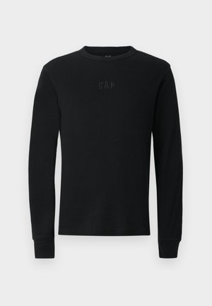 Black long-sleeve ribbed crewneck shirt with subtle embossed GAP logo on the chest.