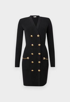 Fekete bordázott kötött hosszú ujjú ruha mély V-nyakkal, dupla sorban arany gombokkal, elöl zsebek arany lánc- és csatt díszítéssel.