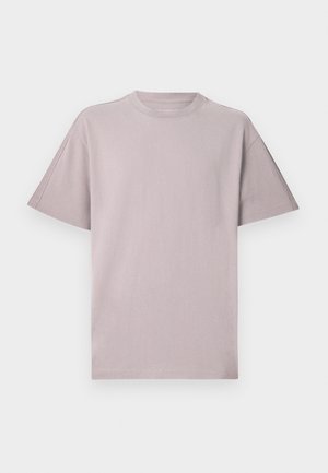 T-shirt à manches courtes en mauve clair avec encolure ronde. Confectionné en coton doux, il présente une coupe décontractée avec des détails de coutures discrètes.