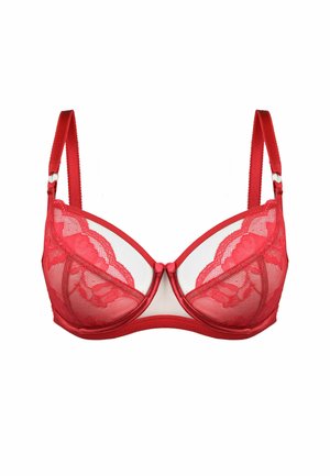 Czerwony koronkowy stanik z poduszkami, przezroczystymi panelami z siateczki oraz regulowanymi ramiączkami. Posiada falbaniastą koronkową zdobienie i akcent w postaci kokardki z przodu.