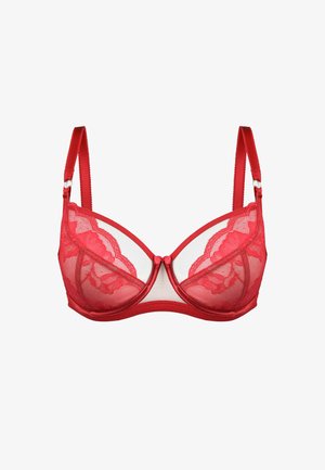 Czerwony koronkowy stanik z poduszkami, przezroczystymi panelami z siateczki oraz regulowanymi ramiączkami. Posiada falbaniastą koronkową zdobienie i akcent w postaci kokardki z przodu.