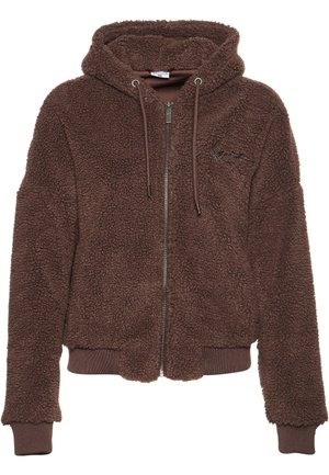 Ruda pūkuota zip-up gaubtas su tekstūruotu paviršiumi, elastingomis rankovėmis ir apačia. Įrengtas su raišteliu reguliojamu gaubtu ir išsiuvinėtu logo detaliu.