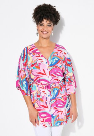 Kleurige bloemenprint tuniek in roze, rood en turquoise. Heeft een V-hals, korte mouwen en een verstelbare trekkoord in de taille.