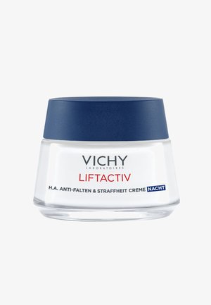 White glass jar with a navy blue lid, labeled "Vichy Liftactiv H.A. Anti-Falten & Straffheit Creme Nacht." Smooth texture, minimalistic design.