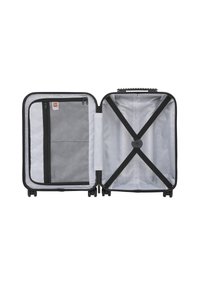 Black hard-shell suitcase with a silver interior; features a mesh zippered pocket, cross straps, and a textured handle on top.