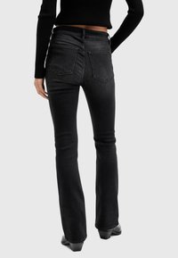 AllSaints HALDAN - Bootcut-farkut - black