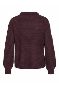 Mörk burgunderröd stickad tröja med ett strukturerat mönster, rundad halsringning och långa ärmar. Har ribbade ärmslut och fåll.