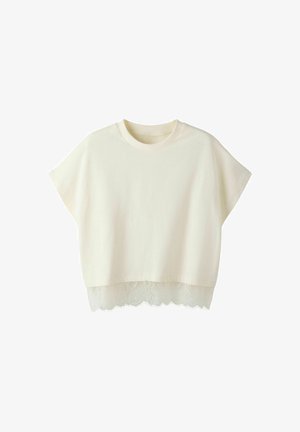 Kortærmet, flødefarvet cropped top med rund halsudskæring og blonderkant ved kanten.