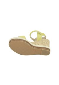 Yellow wedge sandal featuring a cork heel, textured rubber sole, and adjustable straps for a secure fit. Soft suede upper with minimal design.