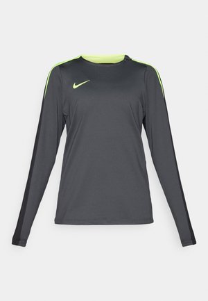 Langärmliges Sporthemd in Dunkelgrau mit neon grünen Akzenten auf den Schultern. Hergestellt aus leichtem, atmungsaktivem Stoff und mit Rundhals-Ausschnitt.