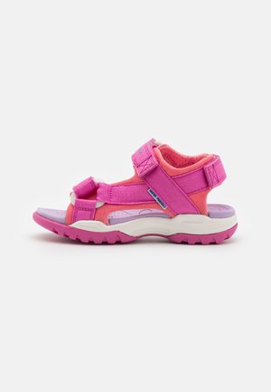 Pink and purple sandal with adjustable straps, textured mesh upper, and a rugged sole for grip. Features a cushioned insole and reinforced toe.