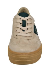 Beige suede sneaker with a green accent and textured gum sole, featuring round laces and a padded tongue for comfort.